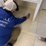 Dry Pros technician inspecting water damaged flooring in Metro Atlanta home